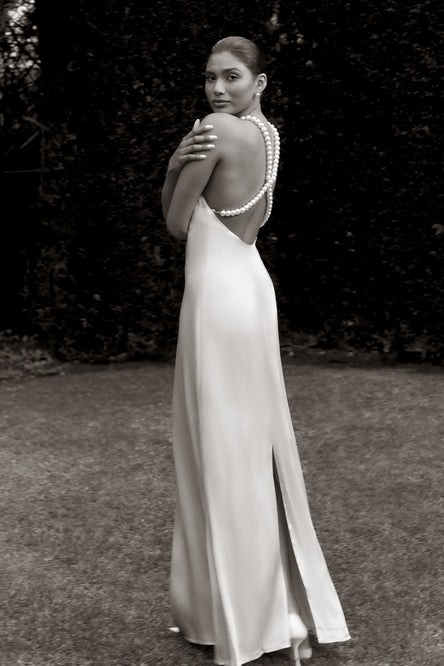 Image of woman in apricot maxi dress.